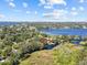 Stunning aerial view of the property near a beautiful blue lake at 1035 W Minnehaha Ave, Clermont, FL 34711