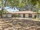 Charming one-story home featuring a cozy front porch at 1035 W Minnehaha Ave, Clermont, FL 34711