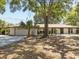 Charming one-story home featuring a cozy front porch and attached garage at 1035 W Minnehaha Ave, Clermont, FL 34711