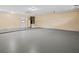 Spacious garage with painted floor and ample room for storage at 1035 W Minnehaha Ave, Clermont, FL 34711
