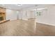 Bright and spacious living room with a fireplace, modern flooring, and neutral paint at 1035 W Minnehaha Ave, Clermont, FL 34711