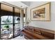 Bedroom with grand piano opens to private balcony. A harmonious blend of music and serene outdoor views at 1055 Kensington Park Dr # 609, Altamonte Springs, FL 32714