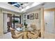Bright breakfast nook with eat in glass table and sliding glass doors to outdoor patio area at 1055 Kensington Park Dr # 609, Altamonte Springs, FL 32714