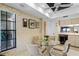 Bright breakfast nook with eat in glass table with a view of the neighborhood at 1055 Kensington Park Dr # 609, Altamonte Springs, FL 32714