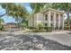 Exterior shot of a community building with manicured landscaping and a gated entrance at 1055 Kensington Park Dr # 609, Altamonte Springs, FL 32714