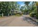 Well-maintained community entrance with manicured landscaping and mature trees at 1055 Kensington Park Dr # 609, Altamonte Springs, FL 32714