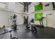 Bright exercise room equipped with various machines and mirrored ceiling, ideal for home fitness at 1055 Kensington Park Dr # 609, Altamonte Springs, FL 32714