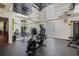 Bright exercise room featuring mirrored ceiling with exercise machines and fitness equipment at 1055 Kensington Park Dr # 609, Altamonte Springs, FL 32714