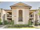 Charming condo building with manicured landscaping, and second-floor covered balconies at 1055 Kensington Park Dr # 609, Altamonte Springs, FL 32714