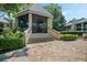 Charming community gazebo with screened enclosure and brick pavers, surrounded by meticulously landscaped grounds at 1055 Kensington Park Dr # 609, Altamonte Springs, FL 32714