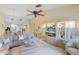 Open concept living room featuring a modern entertainment center and comfortable sectional sofa for relaxing and entertaining at 1055 Kensington Park Dr # 609, Altamonte Springs, FL 32714