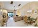Bright living area with vaulted ceilings, a fireplace, and sliding glass doors to a balcony at 1055 Kensington Park Dr # 609, Altamonte Springs, FL 32714