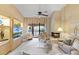 Inviting living area with neutral tones, a fireplace, and sliding glass doors to the balcony at 1055 Kensington Park Dr # 609, Altamonte Springs, FL 32714