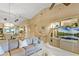 Spacious living room featuring a modern entertainment center and comfortable sectional sofa for relaxing and watching TV at 1055 Kensington Park Dr # 609, Altamonte Springs, FL 32714