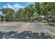 Community parking lot surrounded by mature trees providing lots of shade at 1055 Kensington Park Dr # 609, Altamonte Springs, FL 32714
