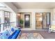 Spacious patio with cozy seating, views into the kitchen, and a door to the front entrance at 1055 Kensington Park Dr # 609, Altamonte Springs, FL 32714