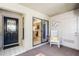 Enclosed patio with tile floors, a rocking chair, and a view into the kitchen through sliding doors at 1055 Kensington Park Dr # 609, Altamonte Springs, FL 32714