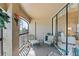 Enclosed patio with floral cushioned seating and a view of the lush surrounding landscape at 1055 Kensington Park Dr # 609, Altamonte Springs, FL 32714