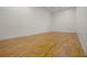 A clean racquetball court features wood floor and plain white walls with simple lines and markings at 1055 Kensington Park Dr # 609, Altamonte Springs, FL 32714