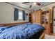 This bedroom has wood paneling, tile floors and custom shelving at 1095 Grand Ave, Orange City, FL 32763