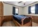 This bedroom has wood paneling, tile floors and lots of windows at 1095 Grand Ave, Orange City, FL 32763