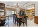 Open dining area leading to the kitchen and a sliding door to the sunroom at 1095 Grand Ave, Orange City, FL 32763