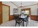 Cozy dining room featuring a table set for four and shelving on the left at 1095 Grand Ave, Orange City, FL 32763
