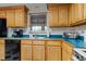 Bright kitchen with appliances and wooden cabinets for plenty of storage at 1095 Grand Ave, Orange City, FL 32763