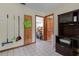Laundry area featuring tile floors, multiple doors, and a built-in desk at 1095 Grand Ave, Orange City, FL 32763