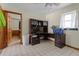Laundry room with tile flooring, a built-in desk, and a view into another room at 1095 Grand Ave, Orange City, FL 32763