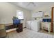 Bright laundry room featuring a washer, dryer, utility sink, and built-in storage, perfect for household tasks at 1095 Grand Ave, Orange City, FL 32763