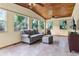 Bright sunroom with tile flooring and large windows offering natural light at 1095 Grand Ave, Orange City, FL 32763