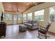 Inviting sunroom featuring tile floors and ample windows for enjoying the outdoors at 1095 Grand Ave, Orange City, FL 32763