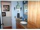 Bathroom featuring a vanity with granite countertop and decorative wall art at 115 W King St, Orlando, FL 32804