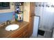 Bathroom featuring a granite vanity countertop and a convenient storage tower at 115 W King St, Orlando, FL 32804