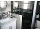 Modern bathroom with a sleek glass shower, updated fixtures and mosaic tile at 115 W King St, Orlando, FL 32804