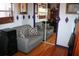 Bedroom with hardwood floors, neutral colors, gray couches and mirror at 115 W King St, Orlando, FL 32804