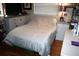 Bedroom with hardwood floors, neutral colors, dresser, and natural light at 115 W King St, Orlando, FL 32804