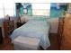 Comfortable bedroom with serene wall art and hardwood floors at 115 W King St, Orlando, FL 32804