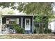 Charming home exterior with landscaped yard and welcoming front door at 115 W King St, Orlando, FL 32804