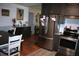 Open-concept kitchen with stainless steel refrigerator and eat-in dining area at 115 W King St, Orlando, FL 32804