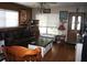 Comfortable living room with a brown leather sofa, wood floors, and bright windows at 115 W King St, Orlando, FL 32804