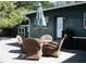 Outdoor patio with wicker furniture, umbrella, grill and backyard shed at 115 W King St, Orlando, FL 32804