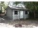 Backyard shed with small deck and exterior lighting at 115 W King St, Orlando, FL 32804