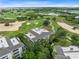 Aerial shot of the community overlooking the golf course, showcasing the building's balconies at 1360 Centre Court Ridge Dr # 201, Reunion, FL 34747