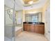 Bright bathroom featuring double vanity, soaking tub, tiled shower, and a decorative wall hanging at 1360 Centre Court Ridge Dr # 201, Reunion, FL 34747