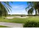 Expansive view of the verdant golf course, showcasing the sand traps and meticulously kept grounds at 1360 Centre Court Ridge Dr # 201, Reunion, FL 34747