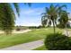 Scenic view of the lush green golf course, sand traps, and well-maintained walking path at 1360 Centre Court Ridge Dr # 201, Reunion, FL 34747