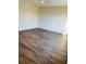 Bedroom featuring wood flooring and natural light from the window at 15090 Waterford Chase Pkwy, Orlando, FL 32828