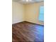 Bedroom featuring wood flooring and natural light from the window at 15090 Waterford Chase Pkwy, Orlando, FL 32828